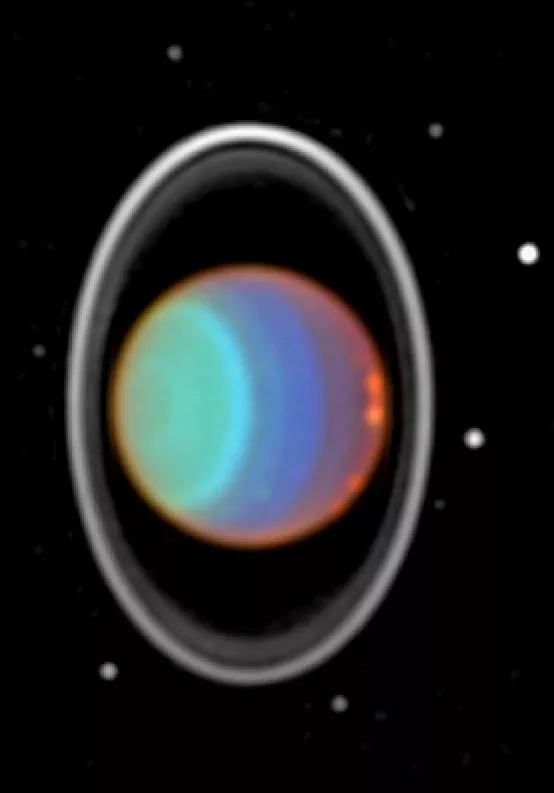 Urano, sus anillos y sus lunas tomadas por el Hubble